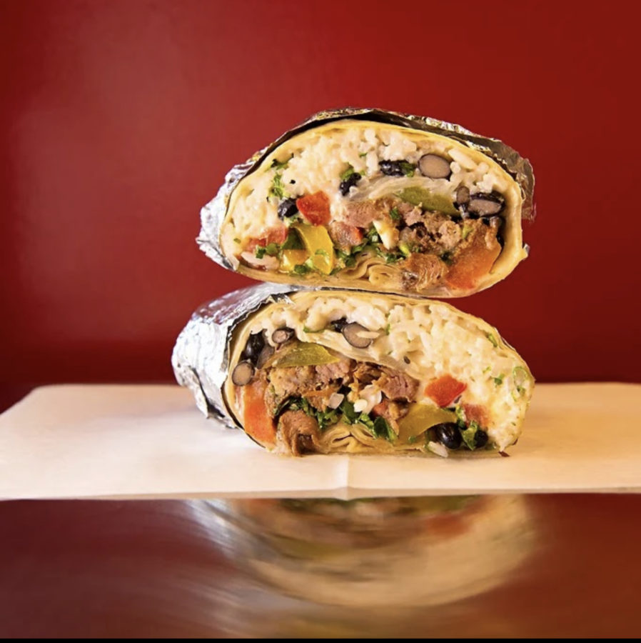 Pictured is Baja Tacos and Burritos custom burrito filled with rice, beans, peppers, tomatoes, and more.  This type of burrito is this reporters favorite meal item, accompanied with steak or carnitas.