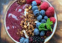  A traditional smoothie bowl made with acai berry and topped with granola and berries similar to those at the new Balanced Cafe in Amherst, NH.