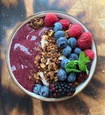 A traditional smoothie bowl made with acai berry and topped with granola and berries similar to those at the new Balanced Cafe in Amherst, NH.