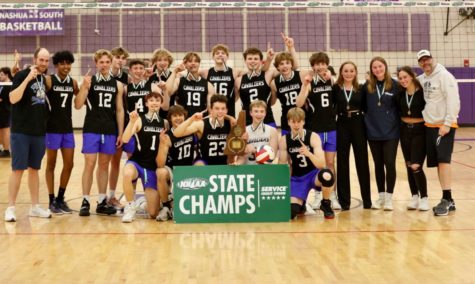 Boys Volleyball players rejoice over their second season sweep and back-to-back Division II wins, in 22 and this season.