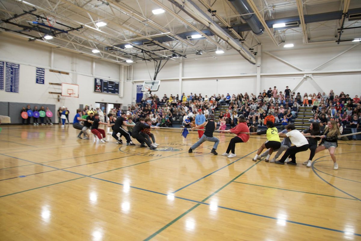 The freshmen and junior classes face an intense standstill in a tug-of-war competition. On October 27, after an action-packed spirit week, Hollis Brookline High School held the annual school-wide Halloween Assembly featuring lots of activities like tug-of-war.  “The Halloween Assembly really brings people together for the Halloween season,” said Charlotte Petrella ‘25.