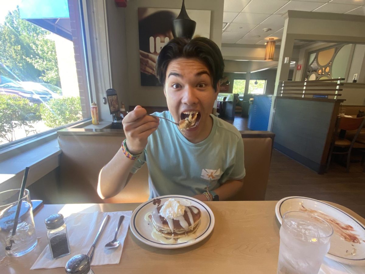 Mason Marshall, writer, eats a bite of a Cinn-A-Stack Pancake Combo.  Marshall recently visited IHOP in Nashua, NH, and decided to try their pancakes.  “I was blown away by this part-savory and mostly sweet breakfast spread,” said Marshall.