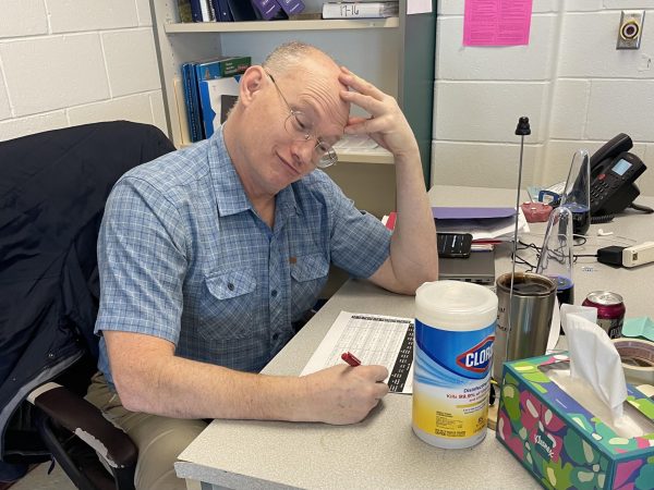 Steven Crooks grades a lab from his AP Physics 1 class. He is a new teacher, but already helping his students succeed with his grading philosophies and policies. “I want to see the thought process [in their work],” said Crooks.