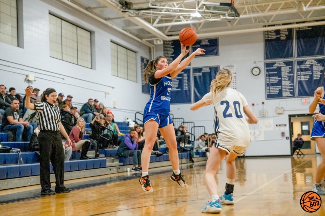 Emily+Tebbetts+shoots+from+the+three+point+line+against+Milford%2C+adding+to+her+record+of+highest+scorer+this+season.+%E2%80%9CTebbetts+is+one+of+our+best+players+this+season%E2%80%9D+said+Coach+Heidie+Moore.+