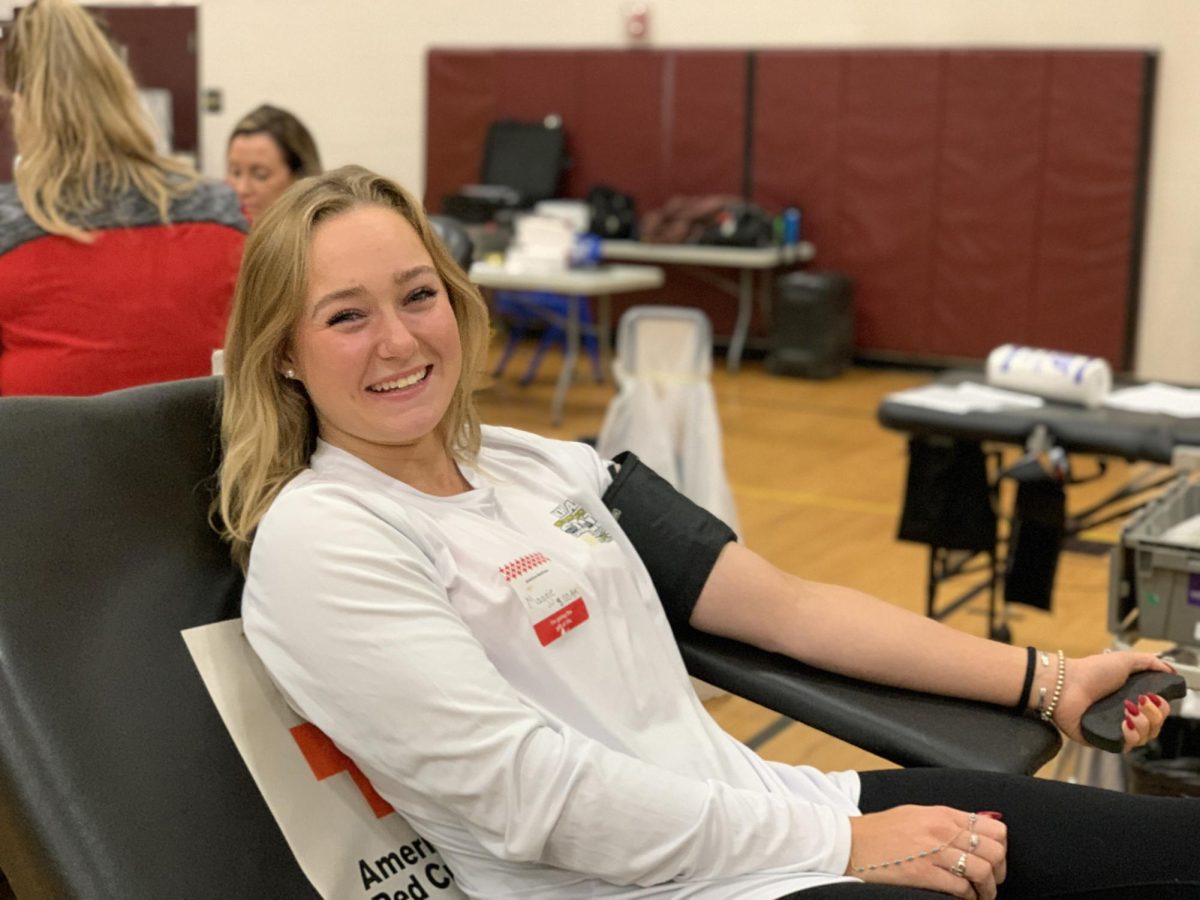 Student Body President Maggie Noble ‘25 has her blood drawn at the Red Cross Club’s blood drive. Noble is a fourth-time blood donor and enjoys participating in the school’s blood drives. “I love donating blood because I can track the impact that it has through the Red Cross app,” said Noble.