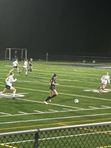 Defensive player Kiera King ‘25 moves the ball back up the field to keep Hollis Brookline in possession of the ball during their 2024 New Hampshire Division II State Championship game against Bow. The Cavaliers ended up winning 1-0 with Marleigh Kreick ‘26 scoring the game-winning point. “They’ll still do pretty good next year because they still have a lot of great players and great talent,” said King. 