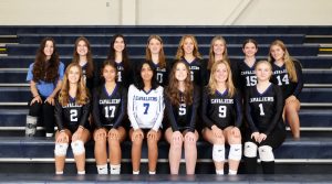 The 2024 Girls Varsity Volleyball Team pictured on the bleachers. They all smile showing their love for the sport and upcoming season. They had a great season, making it to the Semi-Finals and winning the NHVCA Award for the 25th year in a row. (Photo courtesy of Hollis Brookline High School)