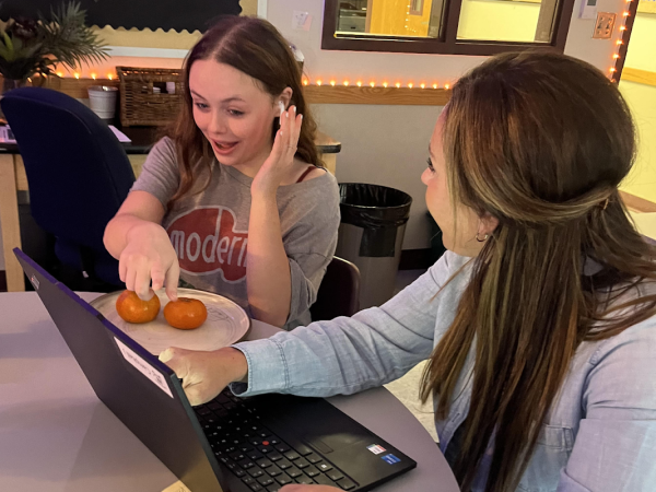 Directed Study teacher Jennifer Campbell is always kind and helpful and assists kids with their work. In this picture, she is helping Aubrey Craig ‘26 with her ROTC information for her CTE program. “I always want my kids to be happy and feel safe in my classroom,” said Campbell.