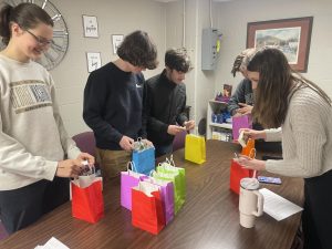 NHS students making midterm kits to hand out to peers the following day. 