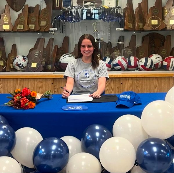 Mackenzie Talbot '25 signs to swim Division 1 at Central Connecticut State University (Courtesy Hollis Brookline High School Athletic Booster Club).