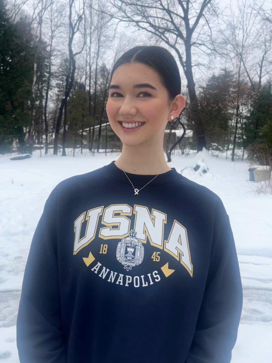 Kate Berrigan smiles while wearing a United States Naval Academy (USNA) sweatshirt. (Image courtesy of Berrigan)