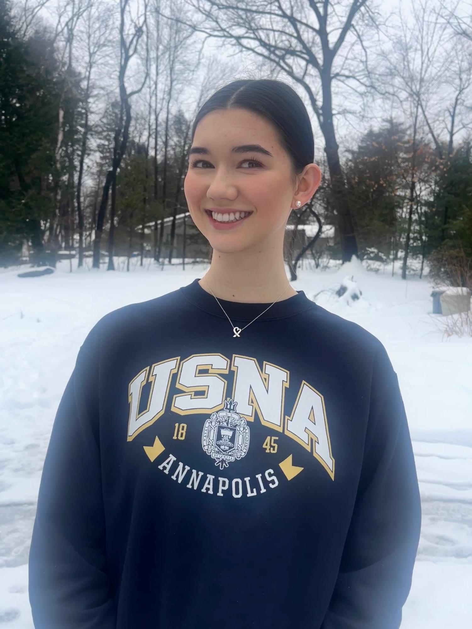 Kate Berrigan smiles while wearing a United States Naval Academy (USNA) sweatshirt. (Image courtesy of Berrigan)