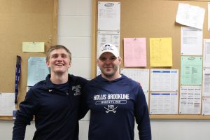 Caden Bruseo '25 and HBHS Wrestling coach Brian Bumpus showing support for each other. “Bumpus is a great coach. He’s always right there, always has a plan, always there to talk to,” said Bruseo. (Image Courtesy Maggie Noble)
