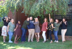 Members of the Hollis Brookline High School Counseling Department pose outside of the school, showing they’re not afraid to show off their fun side. (Image Courtesy Jordan Cormier)