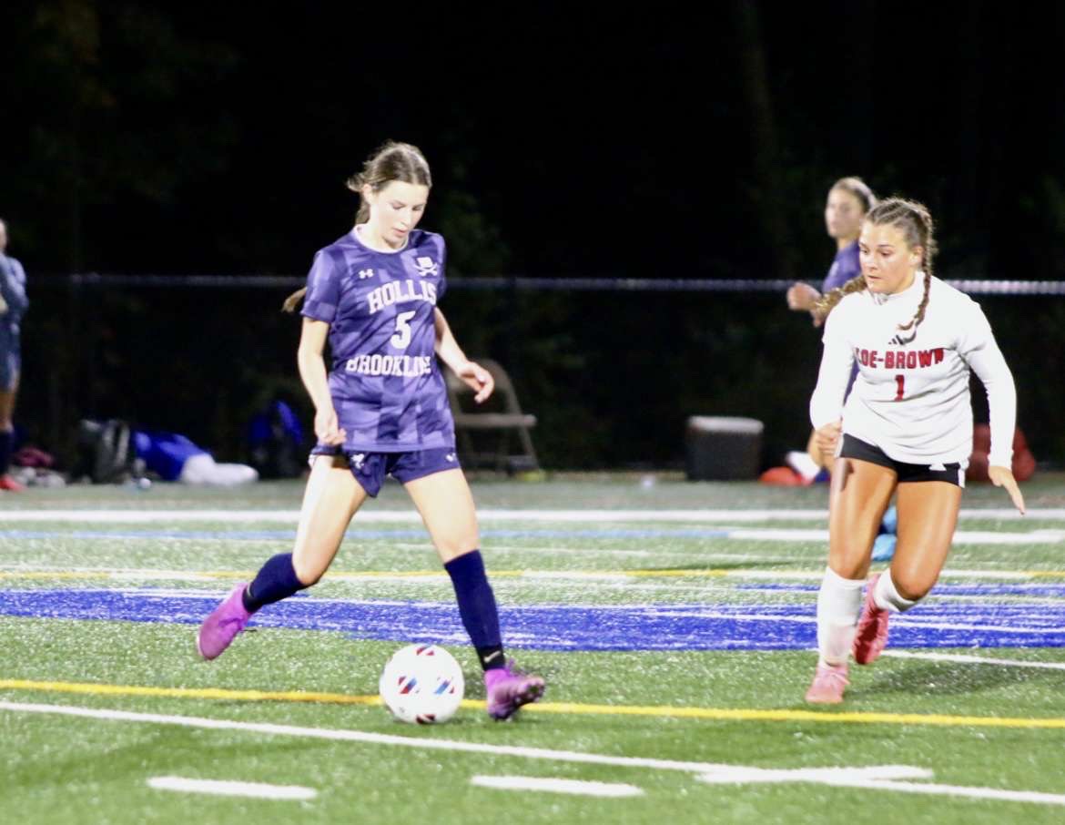 Molly Reardon '26 runs while playing for the Hollis Brookline Varsity Girls Soccer team. (Image courtesy of Reardon)